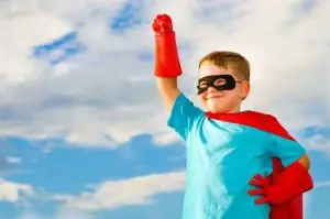 Child pretending to be a superhero